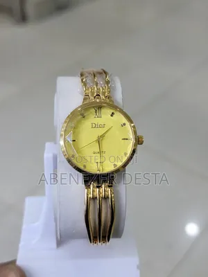 Photo - Christian Dior Quartz Watch With a Gold- Toned Bracelet Yellow Face