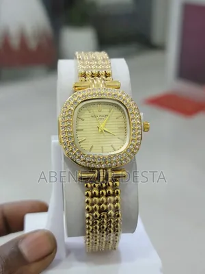 Photo - Gold-Toned, Diamond-Encrusted Patek Philippe Watch With a Square