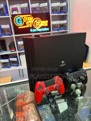 Photo - Playstation 4 Pro With Fifa 25 and Other Games Contact