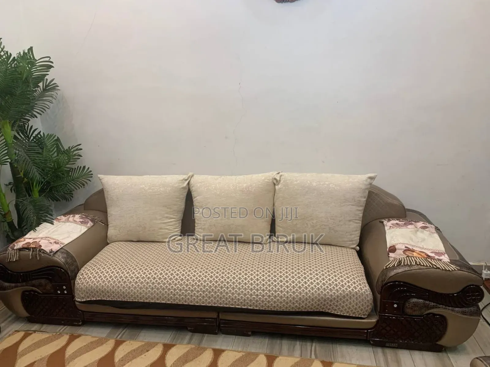 A Unique Sofa Complemented by a Ceramic Table Is a Statement Piece.