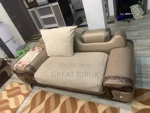 A Unique Sofa Complemented by a Ceramic Table Is a Statement Piece.