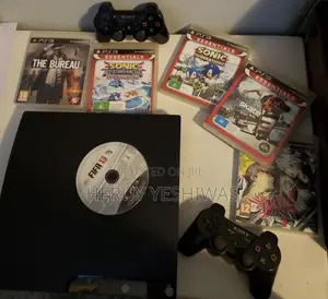 Photo - Playstation 3 (Ps3) + 2 Controllers + Game CDS – Great Condition