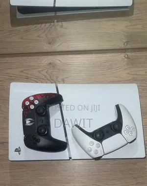 Photo - Ps5 Slim Digital Edition With Two Controller and 2 Games