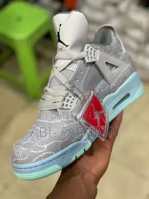 Air Jordan 4 Retro Kaws Sneakers in Cool Grey.