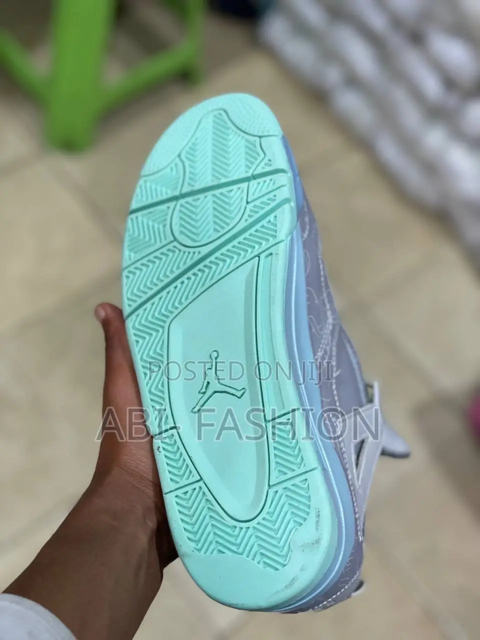 Air Jordan 4 Retro Kaws Sneakers in Cool Grey.