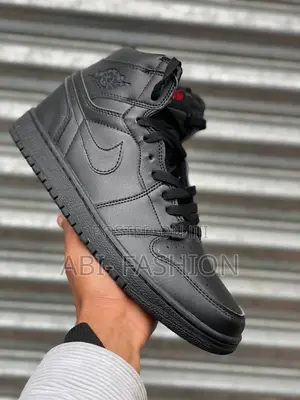 Photo - Nike Air Jordan 1 Retro High Og "Triple Black" Sneakers.