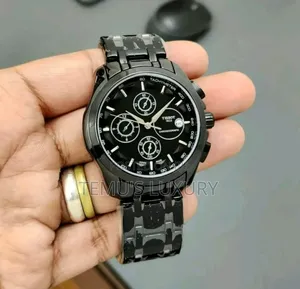 Photo - Tissot 1853 Chronograph Watch With a Black Dial and a Black Strap.