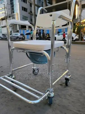 Photo - Commode Chair髷商toilet Chair窗二positioned Over a Standard Toilet.