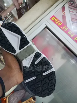 This Is Anike Air Huarache Gripp in a Black, White and Grey Colorway