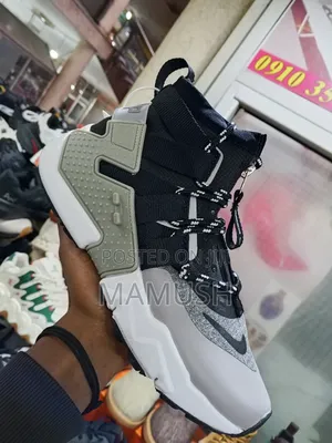 This Is Anike Air Huarache Gripp in a Black, White and Grey Colorway