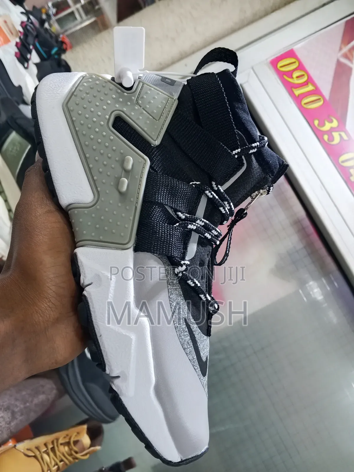 This Is Anike Air Huarache Gripp in a Black, White and Grey Colorway