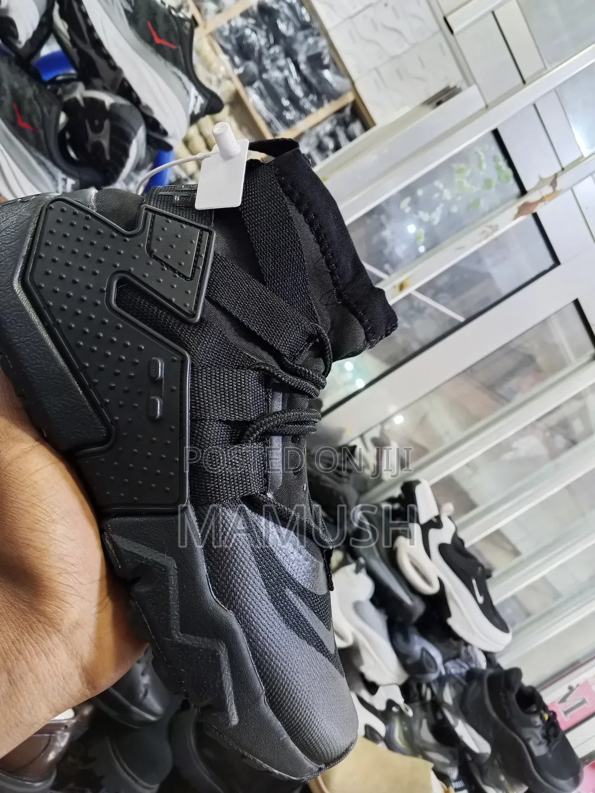 This Is Anike Air Huarache Gripp in a Black, White and Grey Colorway