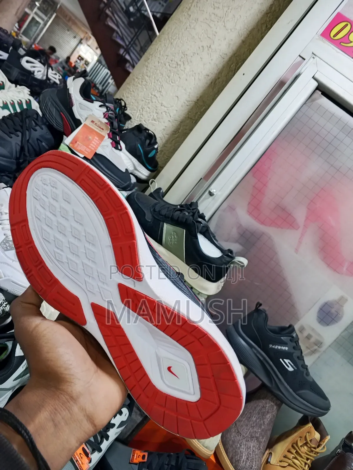 This Is Anike Air Zoom in White and Red in Ablack