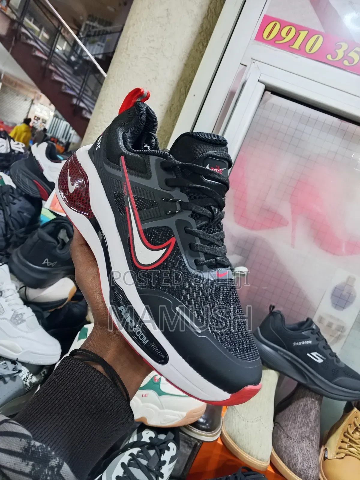 This Is Anike Air Zoom in White and Red in Ablack