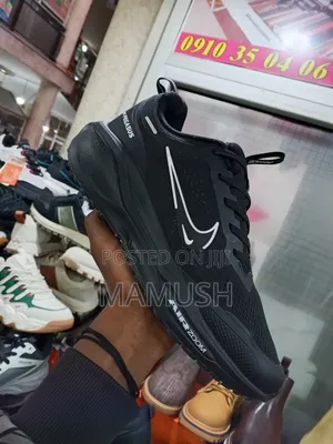 This Is Anike Air Zoom in White and Red in Ablack