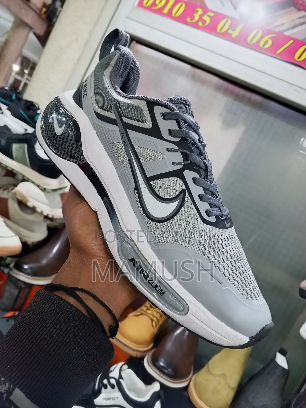 This Is Anike Air Zoom in White and Red in Ablack