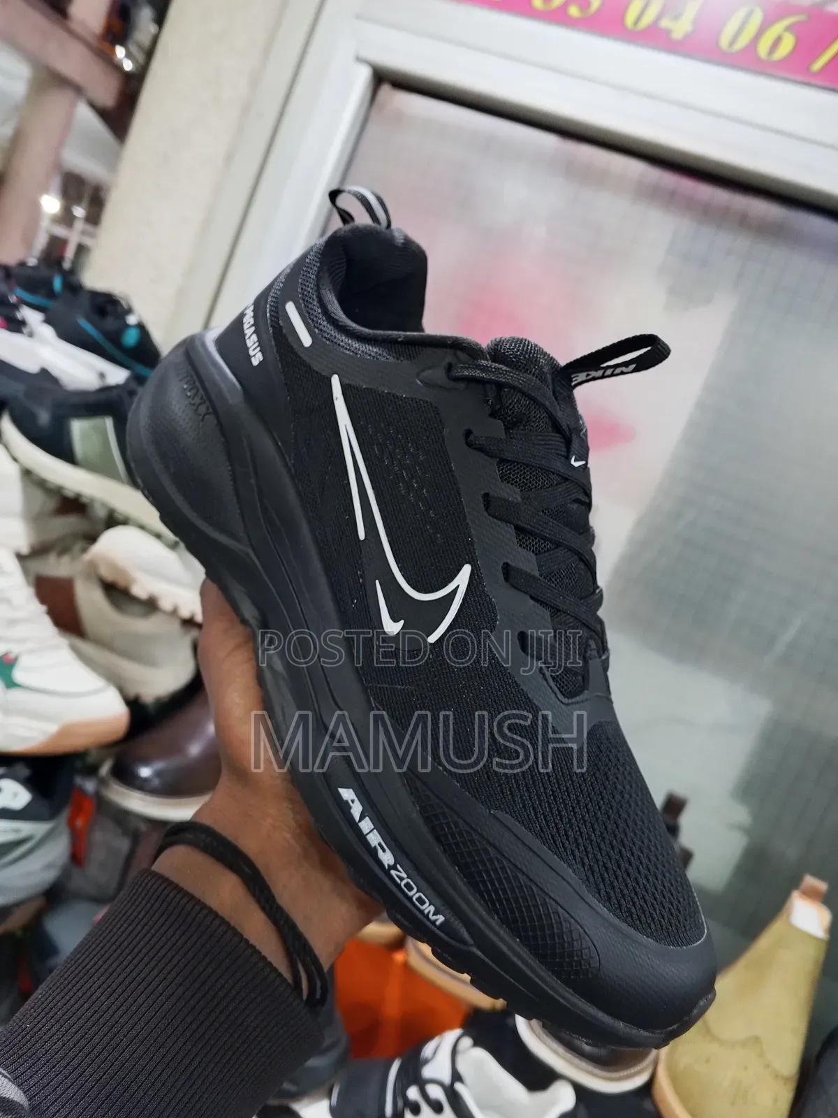 This Is Anike Air Zoom in White and Red in Ablack