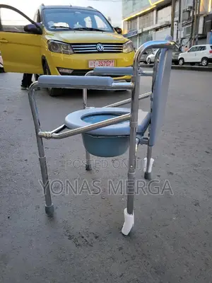 Photo - Commode Chair for Bedside Toilet经use This Lightweight Compact Solution