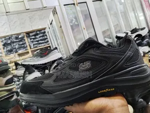 Photo - This Is Ablack,Grey and White Grey Skechers Shoe With a Good Year