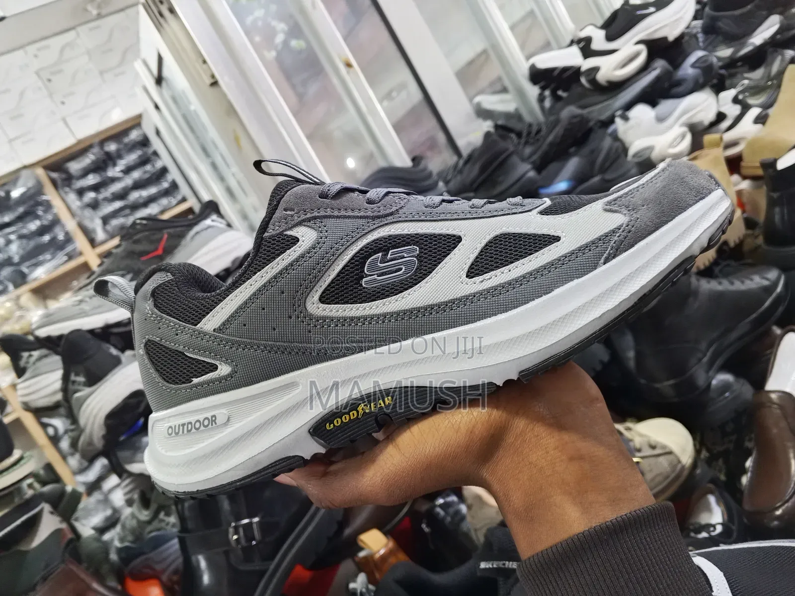 This Is Ablack,Grey and White Grey Skechers Shoe With a Good Year
