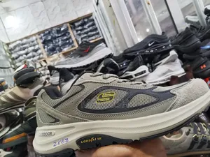 This Is Ablack,Grey and White Grey Skechers Shoe With a Good Year