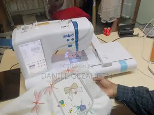 Photo - ኢምብሮደሪ እና የስፌት ማሽን Embroidery and Sewing Machin