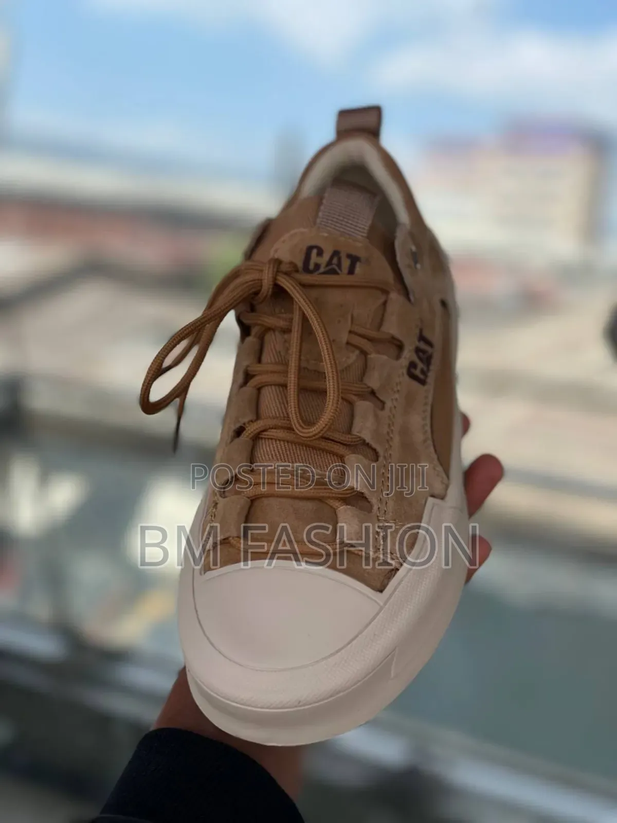 Cat Urban Stride Leather Sneakers in a Brown or Sand Color