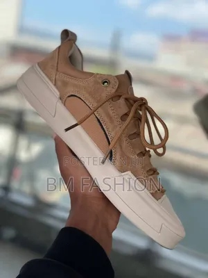 Cat Urban Stride Leather Sneakers in a Brown or Sand Color