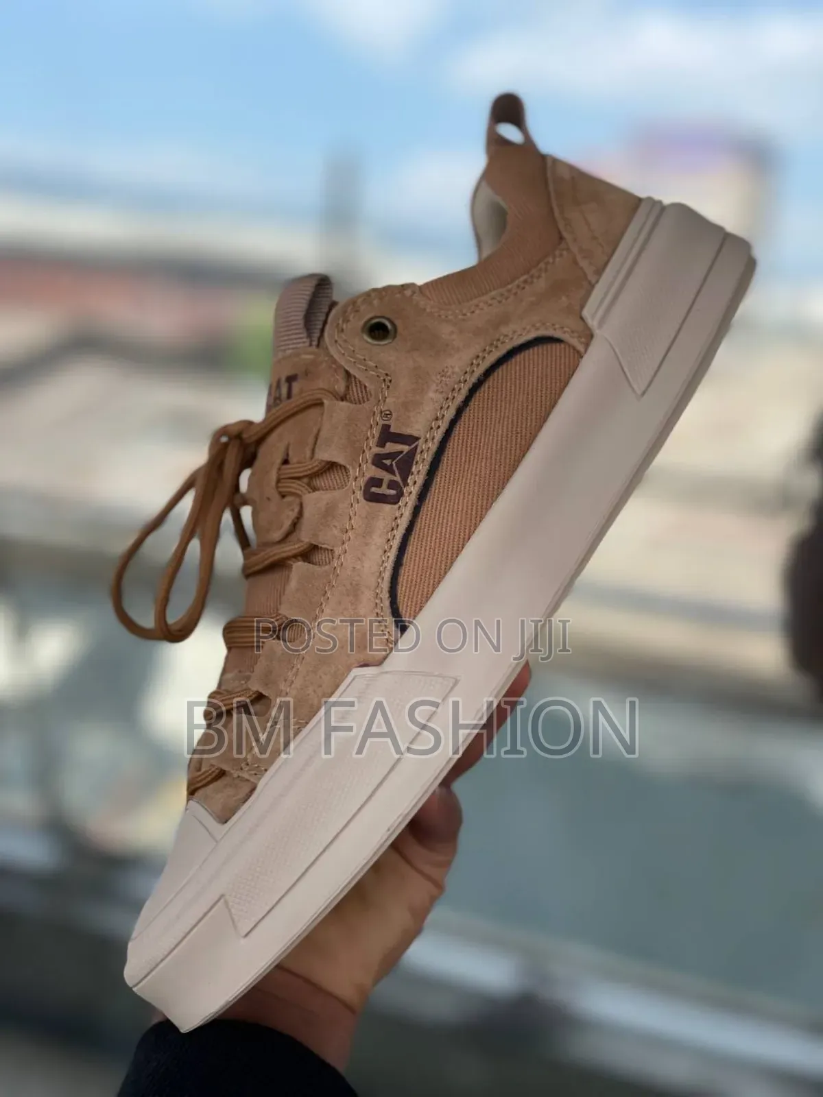 Cat Urban Stride Leather Sneakers in a Brown or Sand Color