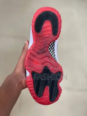 Nike Air Jordan 11 Retro "Bred" Sneakers.