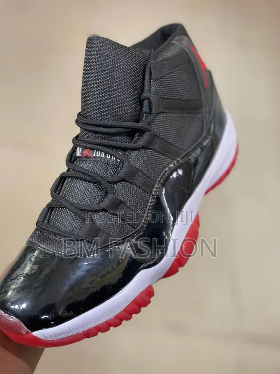 Nike Air Jordan 11 Retro "Bred" Sneakers.
