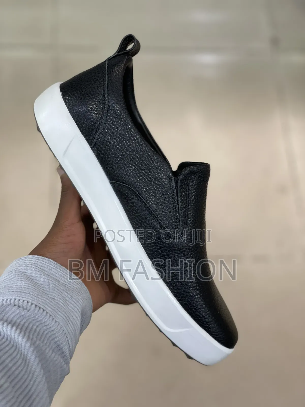 Rockport Men's Total Motion Lite Slip-on Sneaker in Black Leather