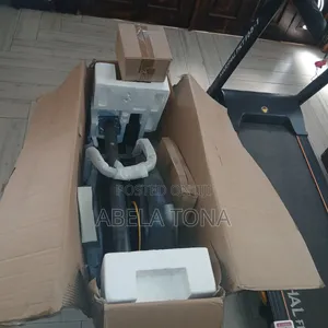 Photo - Pre-Programmed Elliptical Trainer and Marshal Treadmill Foldbel