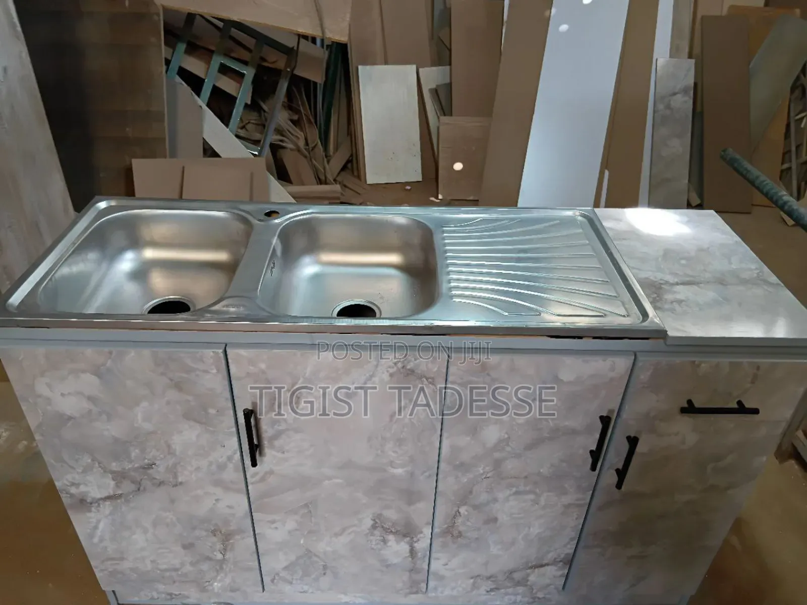 Kitchen Sink Cabinet With a Double Stainless-Steel Basin and Drainer.