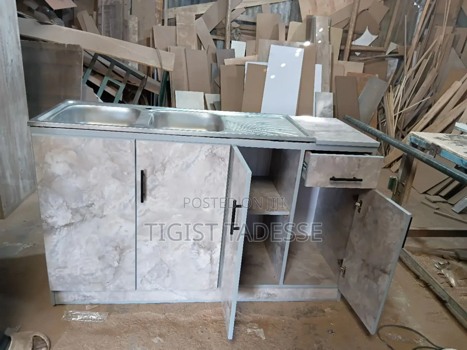 Kitchen Sink Cabinet With a Double Stainless-Steel Basin and Drainer.