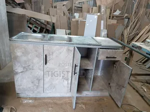 Kitchen Sink Cabinet With a Double Stainless-Steel Basin and Drainer.