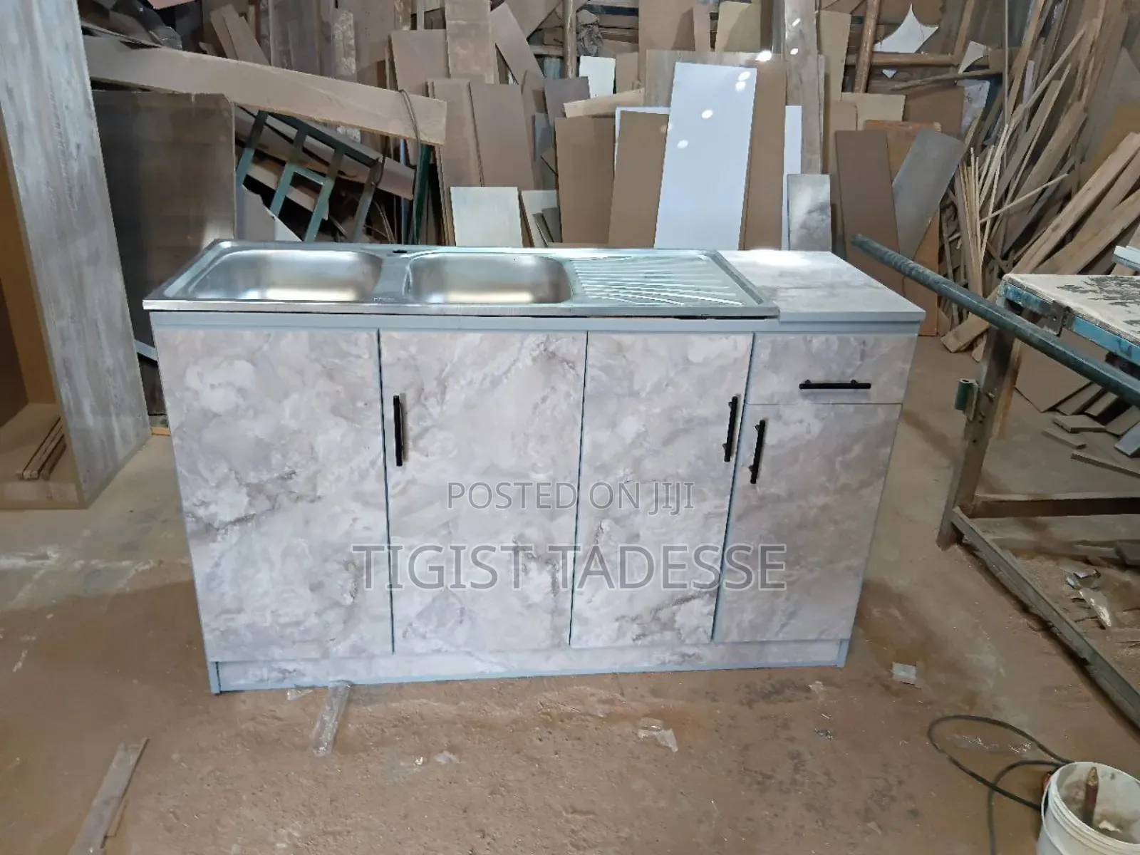 Kitchen Sink Cabinet With a Double Stainless-Steel Basin and Drainer.