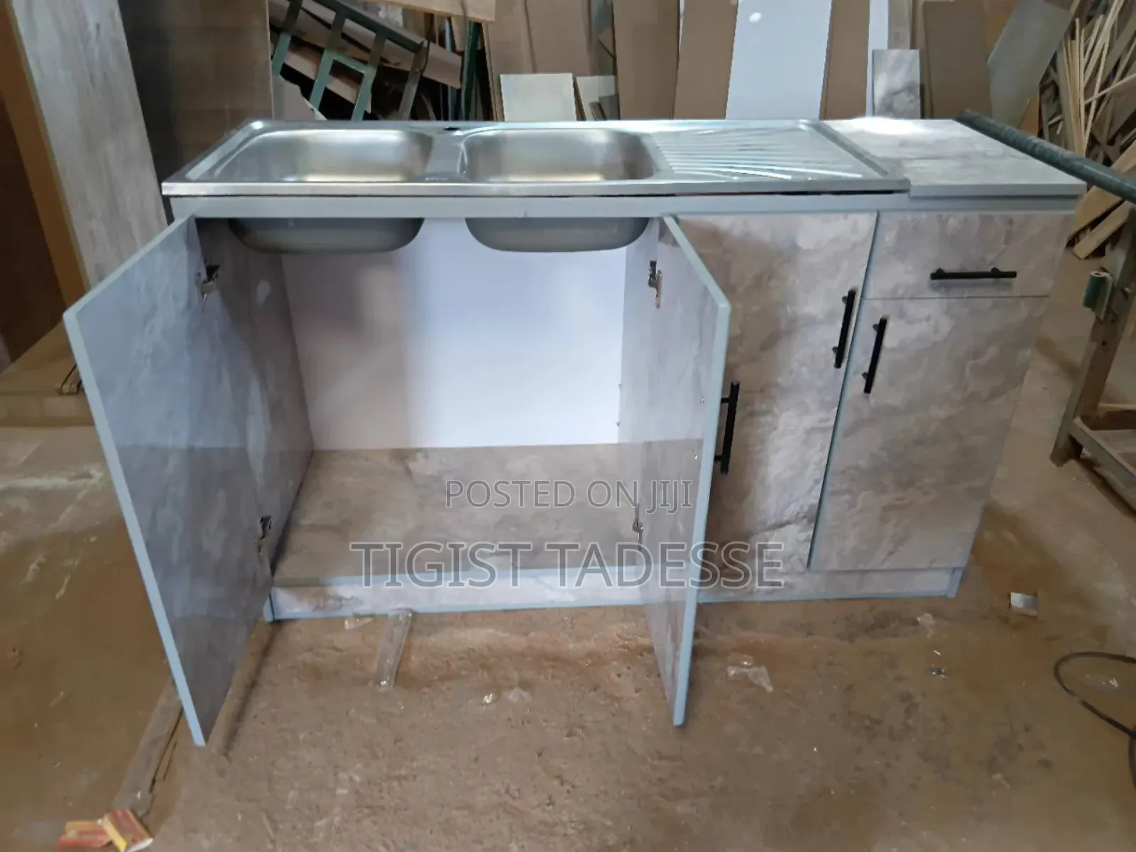 Kitchen Sink Cabinet With a Double Stainless-Steel Basin and Drainer.