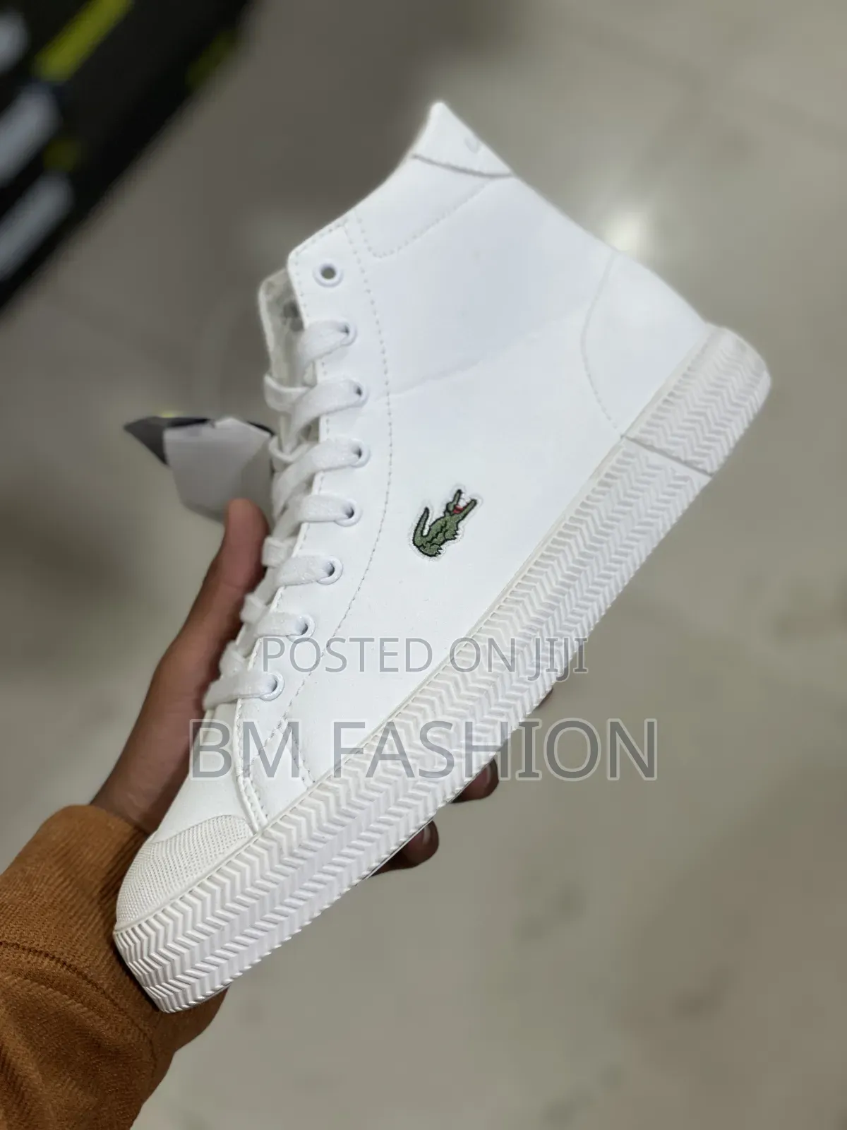 A White Lacoste Gripshot Mid Sneaker
