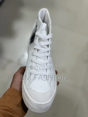 A White Lacoste Gripshot Mid Sneaker