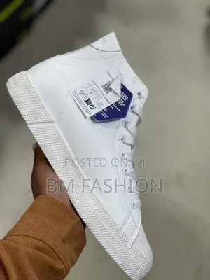 A White Lacoste Gripshot Mid Sneaker