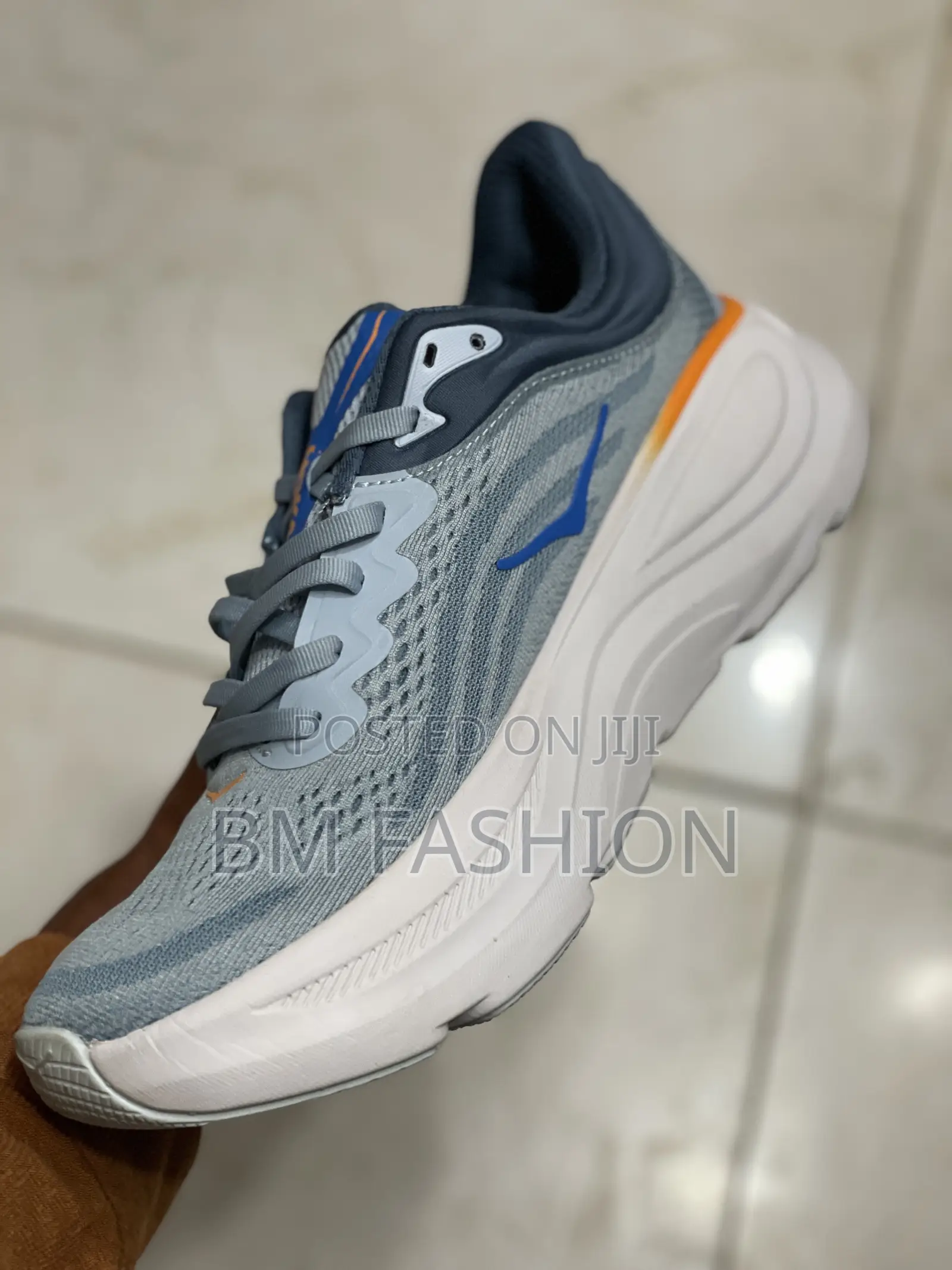 Hoka Bondi 9 Running Shoe in a Blue and Orange Colorway