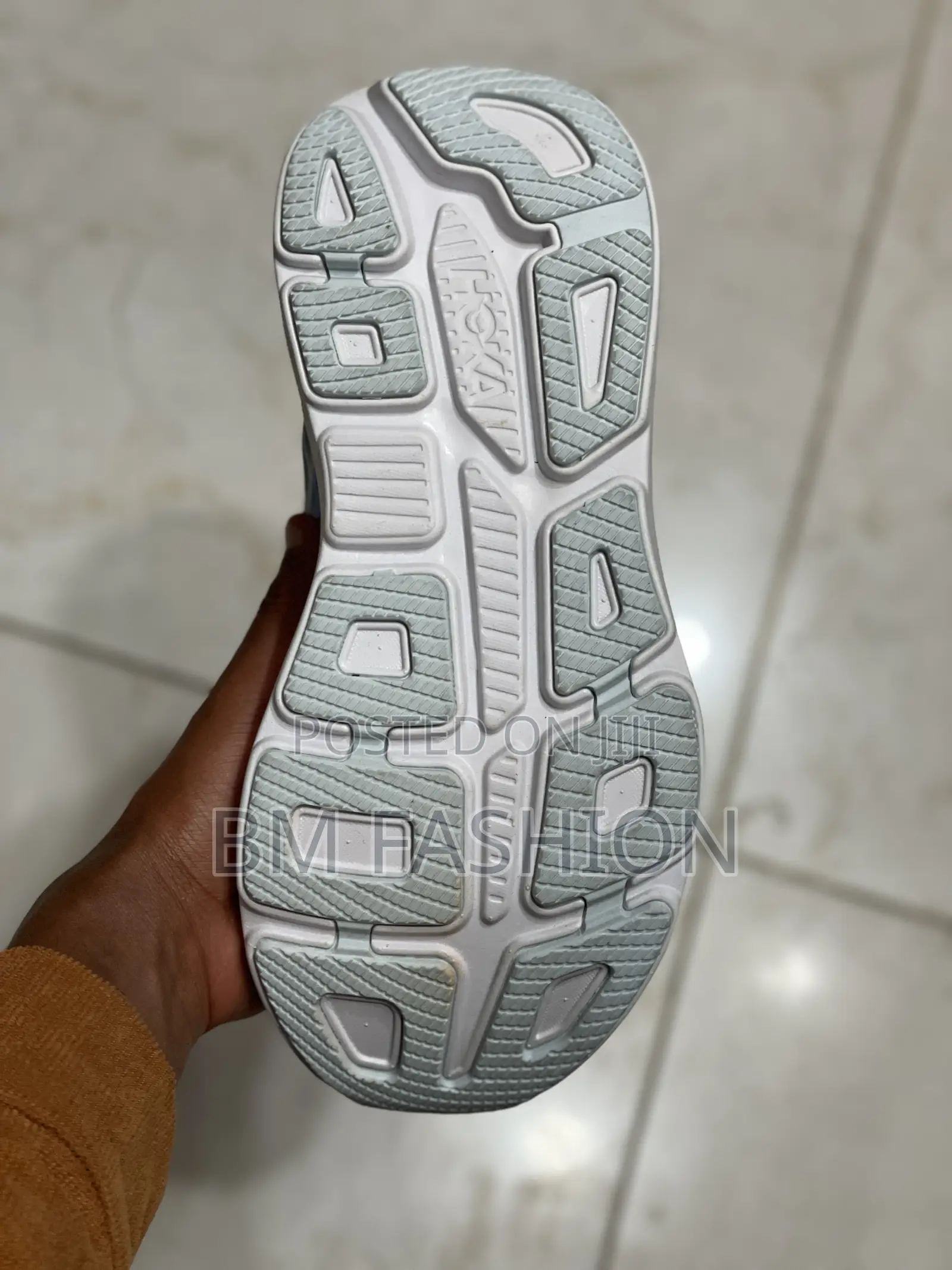 Hoka Bondi 9 Running Shoe in a Blue and Orange Colorway