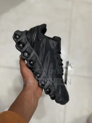 Photo - Nike Air Max Dn8 Men's Shoe in a Black Colorway