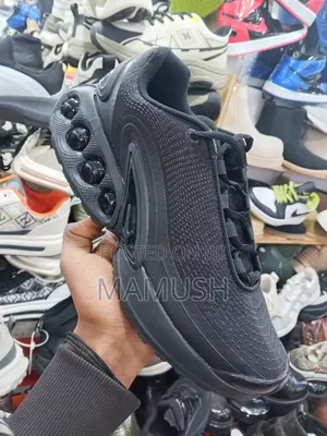 Photo - This Is a Nike Air Max Dn Shoe in Ablack Colorway