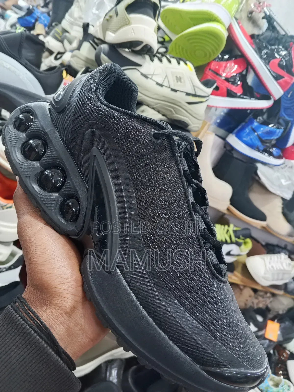 This Is a Nike Air Max Dn Shoe in Ablack Colorway