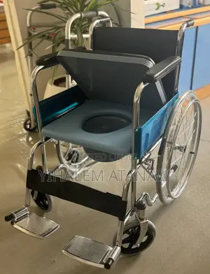 Photo - All-in-One Commode Wheelchair Foldable, Adjustable for Home Or