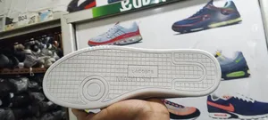 This Is Apair Lacoste Snicers in Beige /Tan Color