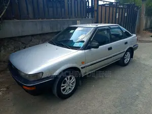 Photo - Toyota Corolla Hatchback 1990 Beige
