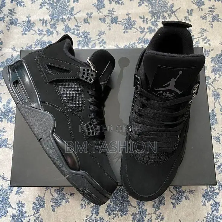 Air Jordan 4 Retro Sneakers in a Black and Light Graphite Colorway